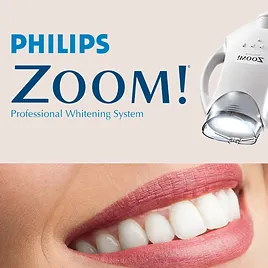 A woman with pink lips and teeth in front of the philips zoom ! system.